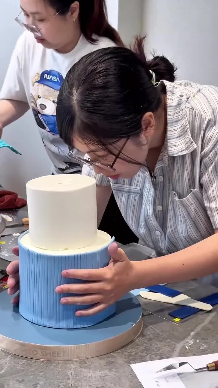 From preparing ingredients and decorating cakes to the finished creations on display.